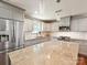 Modern kitchen featuring stainless steel appliances, a kitchen island, and granite counters at 2323 Arden St, Charlotte, NC 28206