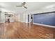 Open-concept living space flowing into the kitchen, featuring hardwood floors and a seamless transition for modern living at 2323 Arden St, Charlotte, NC 28206