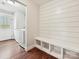 Practical mudroom with built-in bench, storage cubbies, and laundry area, blending functionality and style at 2323 Arden St, Charlotte, NC 28206