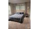 Cozy bedroom with a queen bed, neutral decor, and great natural light at 247 E Cabarrus Ave, Concord, NC 28025