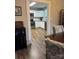 Inviting living room flows from kitchen with modern appliances and white cabinetry at 247 E Cabarrus Ave, Concord, NC 28025