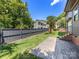 Backyard featuring patio area, grassy yard, and tall fence at 2608 Croydon Rd, Charlotte, NC 28209