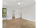 Bedroom featuring hardwood floors, neutral paint, and natural light at 2608 Croydon Rd, Charlotte, NC 28209