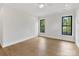 Bright bedroom with hardwood floors, neutral paint, and natural light at 2608 Croydon Rd, Charlotte, NC 28209