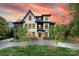 Beautiful two-tone home with modern design and professional landscaping, including a stamped concrete driveway at 2608 Croydon Rd, Charlotte, NC 28209