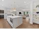 Open concept kitchen features a large island with seating and a view to the living room at 2608 Croydon Rd, Charlotte, NC 28209