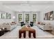 Bright living room featuring hardwood floors, neutral furniture, and recessed lighting at 2608 Croydon Rd, Charlotte, NC 28209