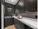 Modern pantry with gray cabinetry, quartz countertops, and stylish hardware for plenty of storage space at 2608 Croydon Rd, Charlotte, NC 28209