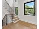 Bright staircase with wood and black metal at 2608 Croydon Rd, Charlotte, NC 28209