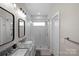 Modern bathroom featuring dual sinks, granite countertops, and a glass-enclosed shower at 2863 Grand Union Way, Charlotte, NC 28209