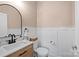 Elegant bathroom with a wooden vanity, dual sinks, and a walk-in shower at 2863 Grand Union Way, Charlotte, NC 28209
