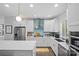 Well-lit kitchen with a stainless steel range hood, subway tile backsplash, and ample counter space at 2863 Grand Union Way, Charlotte, NC 28209