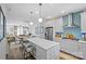 White kitchen featuring stainless steel appliances, shaker cabinets, and a stylish backsplash at 2863 Grand Union Way, Charlotte, NC 28209