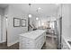 Bright kitchen featuring a large island with white cabinets and modern pendant lighting at 2863 Grand Union Way, Charlotte, NC 28209