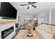 Stylish living room featuring an open layout, hardwood floors, modern decor, and seamless flow to the dining area at 2863 Grand Union Way, Charlotte, NC 28209