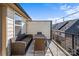 Relaxing outdoor deck with comfortable seating, a dining table, and railing for privacy at 2863 Grand Union Way, Charlotte, NC 28209