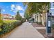 A beautiful street view with foliage and pedestrian walkway on a sunny day in the community at 2863 Grand Union Way, Charlotte, NC 28209