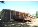 Back of brick home with a wooden deck and fenced area at 288 S Sutton Rd, Fort Mill, SC 29708