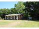 Brick house with well-kept lawn, shed, and mature trees at 288 S Sutton Rd, Fort Mill, SC 29708
