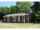 Charming brick home with a columned front porch and black shutters at 288 S Sutton Rd, Fort Mill, SC 29708
