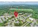 Aerial view of neighborhood with a pin on the property, surrounded by lush greenery and community amenities at 3029 Allendale Dr, Fort Mill, SC 29707