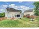Large backyard featuring lush lawn, playset, patio with seating, and fenced perimeter at 3029 Allendale Dr, Fort Mill, SC 29707