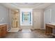 Bathroom with a separate shower, soaking tub, and frosted windows at 3029 Allendale Dr, Fort Mill, SC 29707