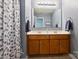 Bathroom featuring double sinks, a large mirror and shower with patterned shower curtain at 3029 Allendale Dr, Fort Mill, SC 29707