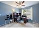 Bedroom provides a ceiling fan, desk, shelves, and a window for a bright and comfortable space at 3029 Allendale Dr, Fort Mill, SC 29707