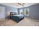 Bedroom with a large window, ceiling fan and neutral color carpet at 3029 Allendale Dr, Fort Mill, SC 29707