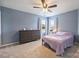 Cozy bedroom with a dresser, ceiling fan and carpet at 3029 Allendale Dr, Fort Mill, SC 29707