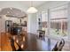 A hardwood floor is featured in the dining room looking towards the kitchen at 3029 Allendale Dr, Fort Mill, SC 29707
