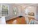 Welcoming entryway with hardwood floors, abundant natural light, and classic archway leading to the dining area at 3029 Allendale Dr, Fort Mill, SC 29707
