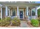 Inviting front porch with stone accents, white columns, and a charming entryway at 3029 Allendale Dr, Fort Mill, SC 29707