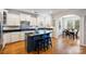 Bright eat-in kitchen features granite counters, an island with seating, stainless steel appliances and white cabinetry at 3029 Allendale Dr, Fort Mill, SC 29707