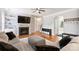 Bright living room featuring a fireplace, built-in shelves, hardwood floors, and ample seating at 3029 Allendale Dr, Fort Mill, SC 29707