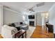 Cozy living room with a fireplace, built-in shelving, hardwood floors, and comfortable seating at 3029 Allendale Dr, Fort Mill, SC 29707