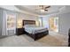 Spacious main bedroom features a tray ceiling, ceiling fan, and ensuite bathroom at 3029 Allendale Dr, Fort Mill, SC 29707