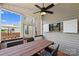 Cozy screened patio with ceiling fan, dining table, chairs, and outdoor television at 3029 Allendale Dr, Fort Mill, SC 29707