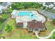 Aerial view of a community pool, featuring well-maintained landscaping, playground, and lounge chairs at 3029 Allendale Dr, Fort Mill, SC 29707