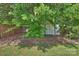 Backyard shed offering extra storage space, surrounded by lush greenery at 3029 Allendale Dr, Fort Mill, SC 29707