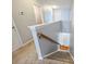 Carpeted staircase with wooden handrail leads to upper level of the home at 3029 Allendale Dr, Fort Mill, SC 29707