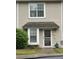 Charming townhome with covered entry, maintained lawn, and traditional architecture at 303 Heritage Pkwy, Fort Mill, SC 29715