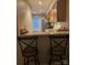 Kitchen with counter seating, granite countertops, stainless appliances, and tile flooring at 303 Heritage Pkwy, Fort Mill, SC 29715