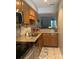 Galley kitchen featuring granite countertops, stainless steel appliances, and modern finishes at 303 Heritage Pkwy, Fort Mill, SC 29715