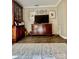 Living room featuring hardwood floors, a large TV, and traditional furnishings at 303 Heritage Pkwy, Fort Mill, SC 29715