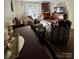 Open-concept living room with plush seating, natural light, and hardwood flooring at 303 Heritage Pkwy, Fort Mill, SC 29715