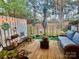 Cozy back patio with a comfortable cushioned sofa and privacy fence at 303 Heritage Pkwy, Fort Mill, SC 29715