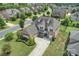 Aerial view of a beautiful house in a suburban neighborhood with lush trees and manicured lawns at 305 Decanting Ln, Fort Mill, SC 29707