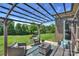 Beautiful backyard under a pergola with outdoor seating, perfect for relaxation at 305 Decanting Ln, Fort Mill, SC 29707